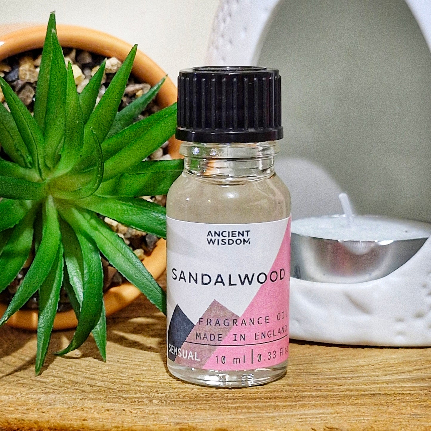 A 10ml bottle of sandalwood fragrance oil 